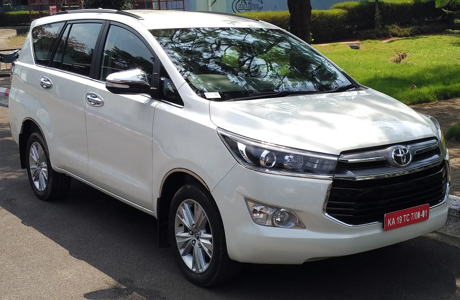White Toyota Innova Crysta parked kerbside, the most-booked 7-seater for Chennai outstation trips